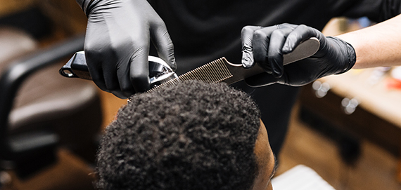 professional hair stylest useing a Aluminum comb